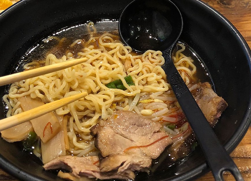 bowl of ramen with spoon and chopsticks
