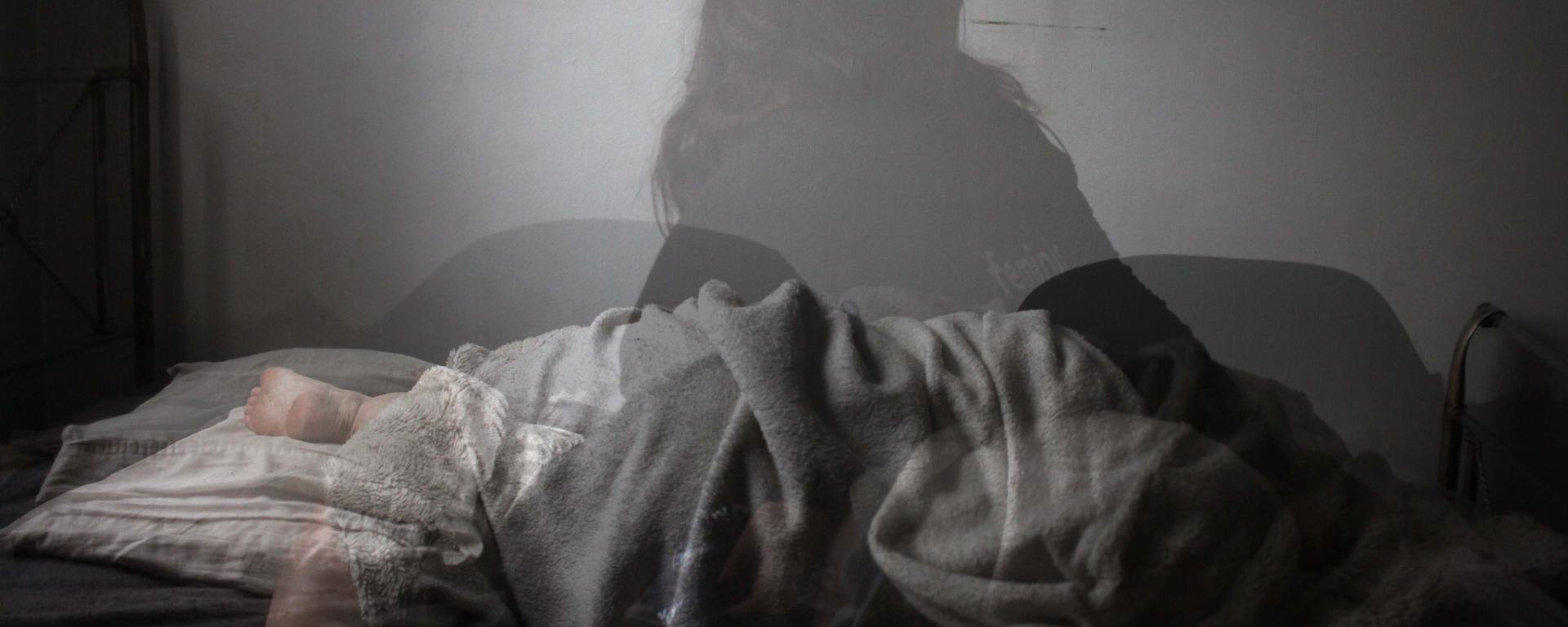 woman laying in bed with translucent overlay of woman in different positions